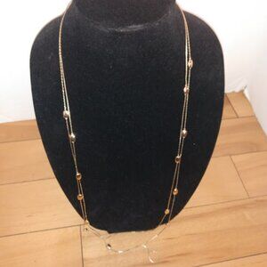 BR: the B is reversed. Gold tone beaded chain necklace.